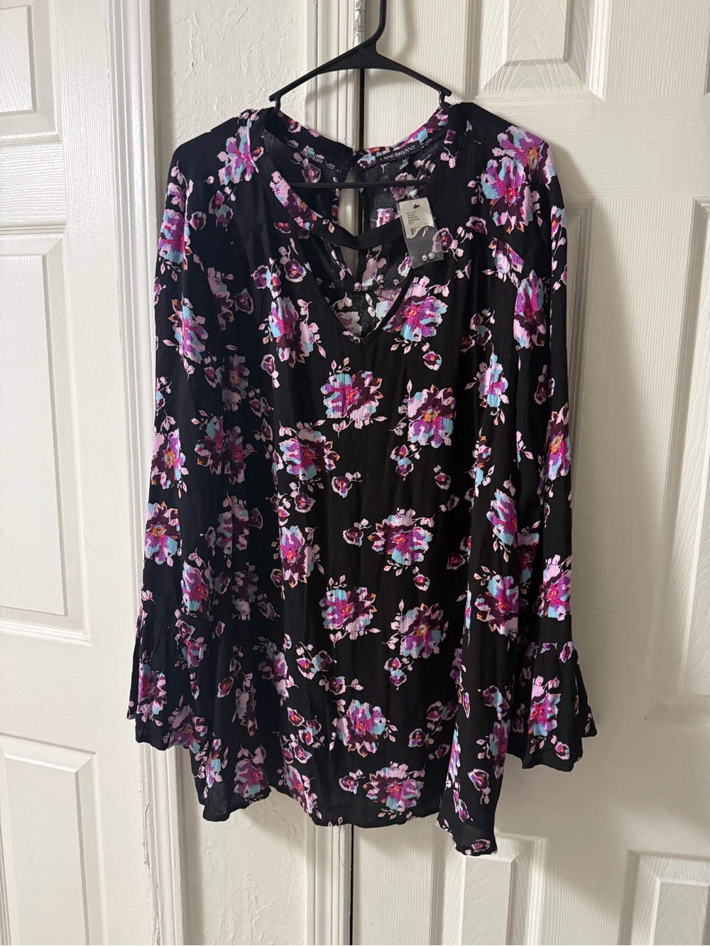 Lane Bryant black floral blouse featuring a distinct choker neck design